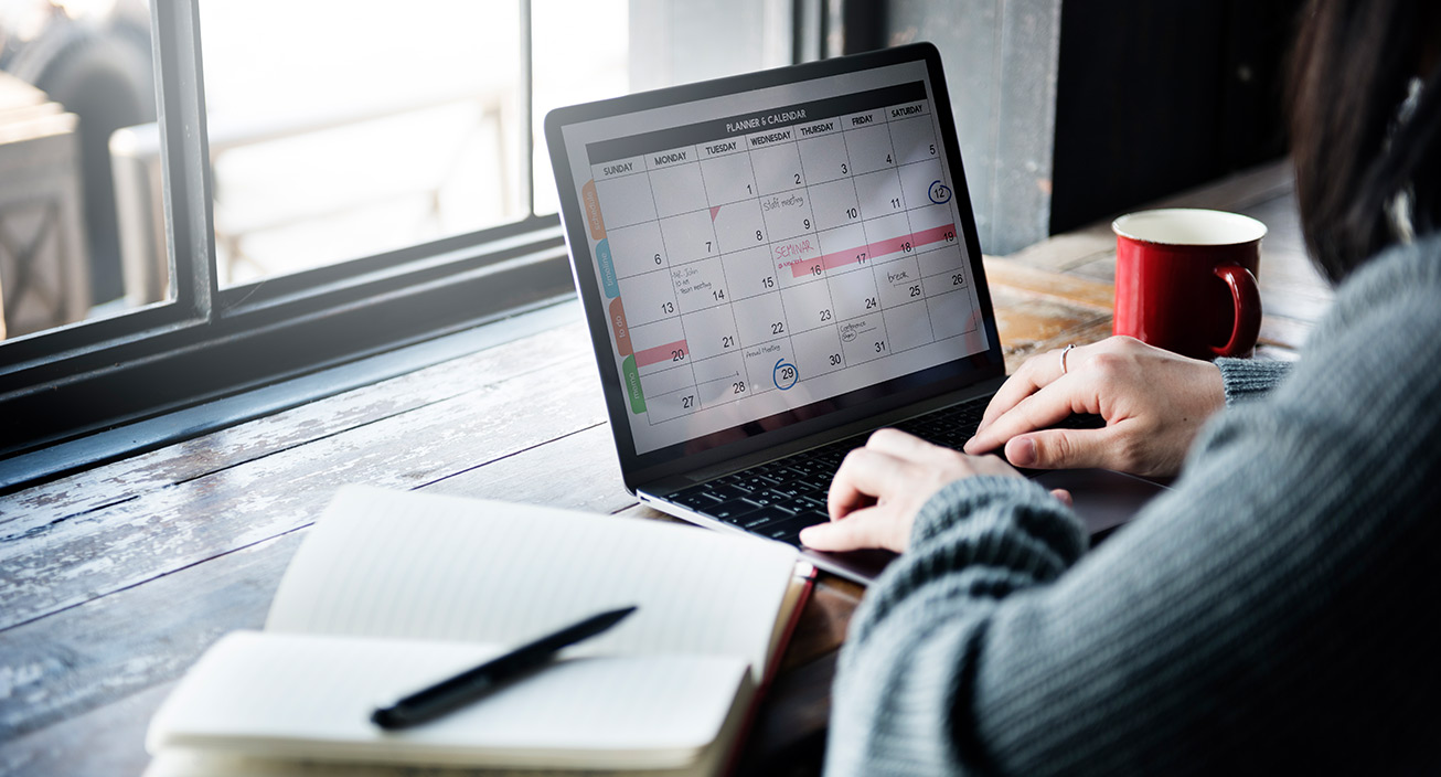 woman on laptop planning her schedule