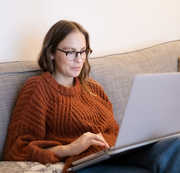 Woman Wearing Glasses On Her Laptop