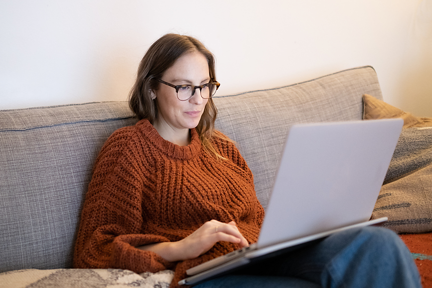Woman Wearing Glasses On Her Laptop