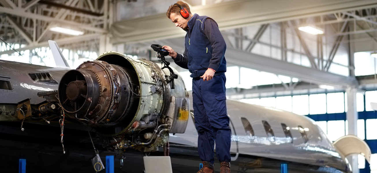aircraft-mechanic-hangar-inspecting-repair