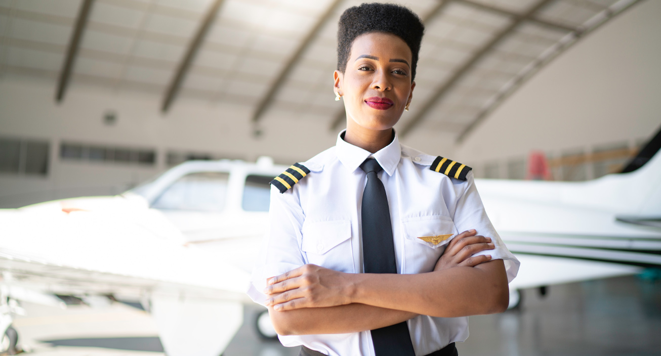 airplane-pilot-woman-hangar-confident