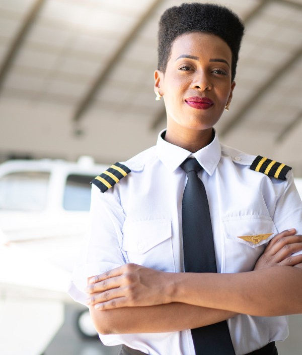 airplane-pilot-woman-hangar-confident