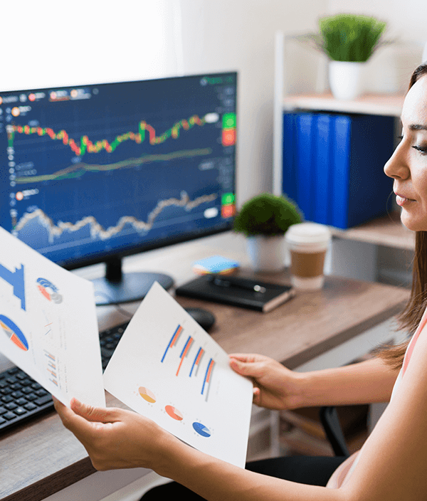 business woman analyzing stocks data at home